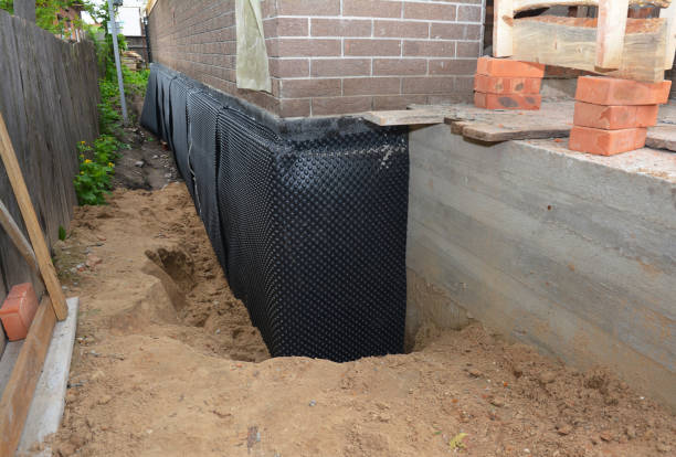 Happy homeowners after waterproofing job in Chaffee